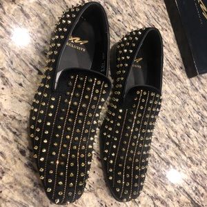 Black and gold loafers